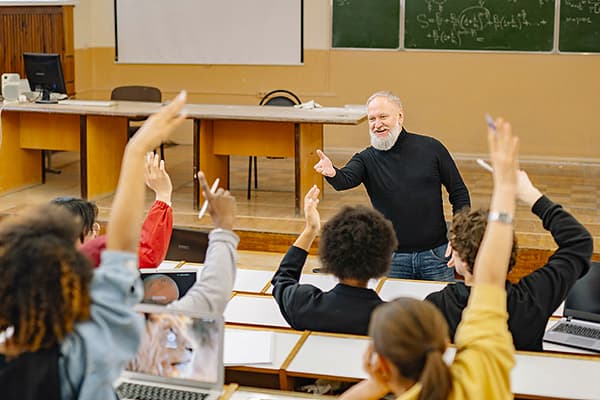 Teacher making gesture in class room