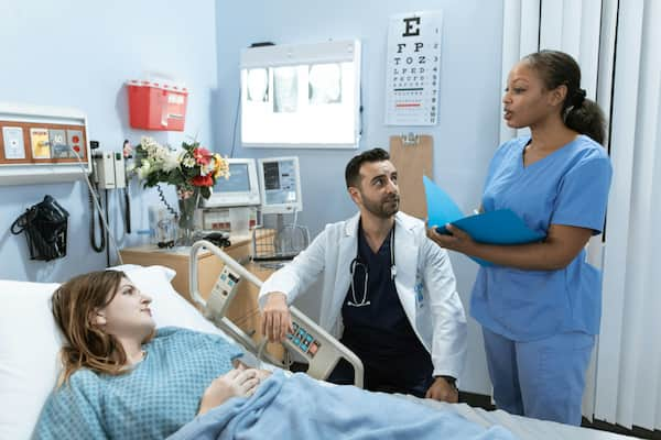 doctor with nurse and patient