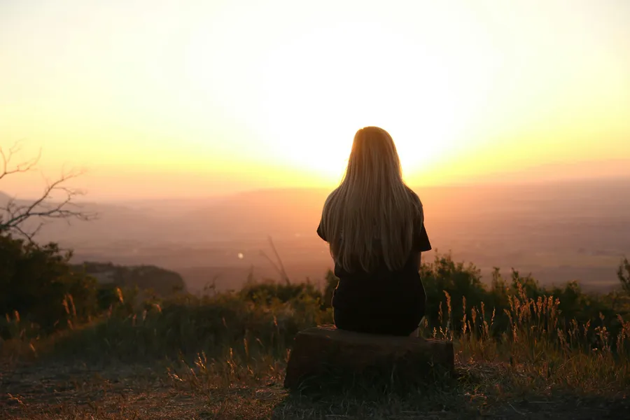Woman looking at the sunset