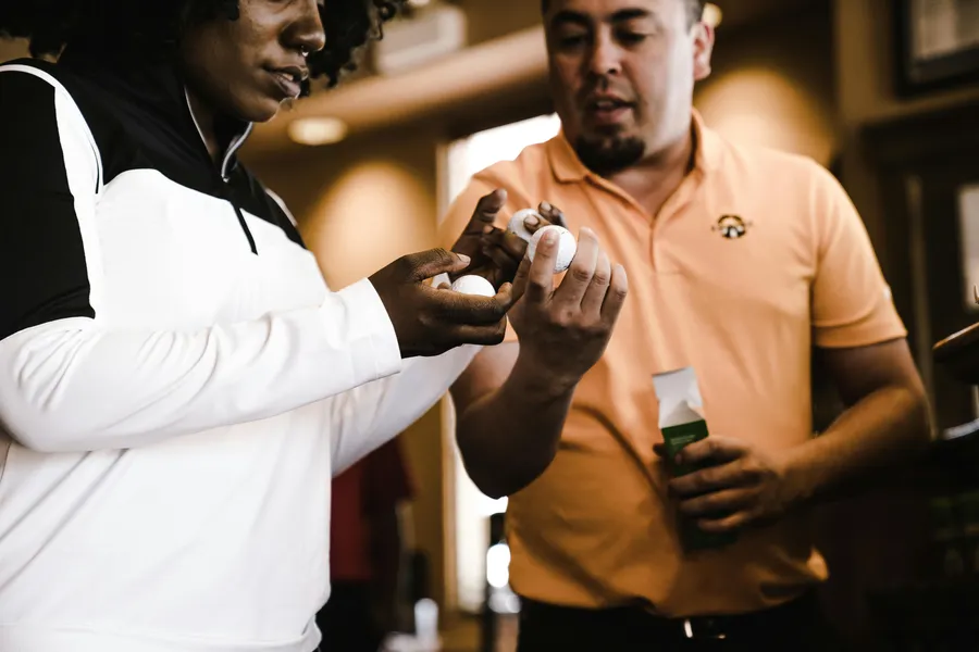 Two men evaluating consumer products in a retail setting