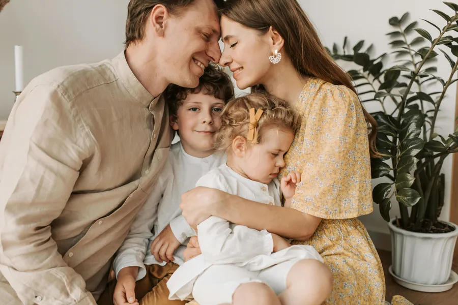 Warm family connection and parenting love in cozy home setting"