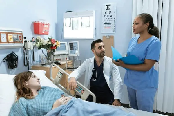 Doctor meeting with a nurse and patient