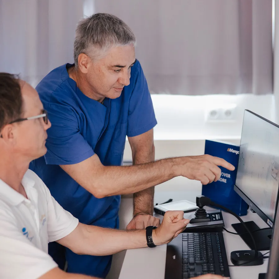 Doctor and trainer discuss the results of medical simulations