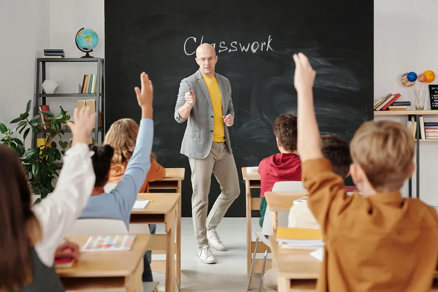Teacher helping student